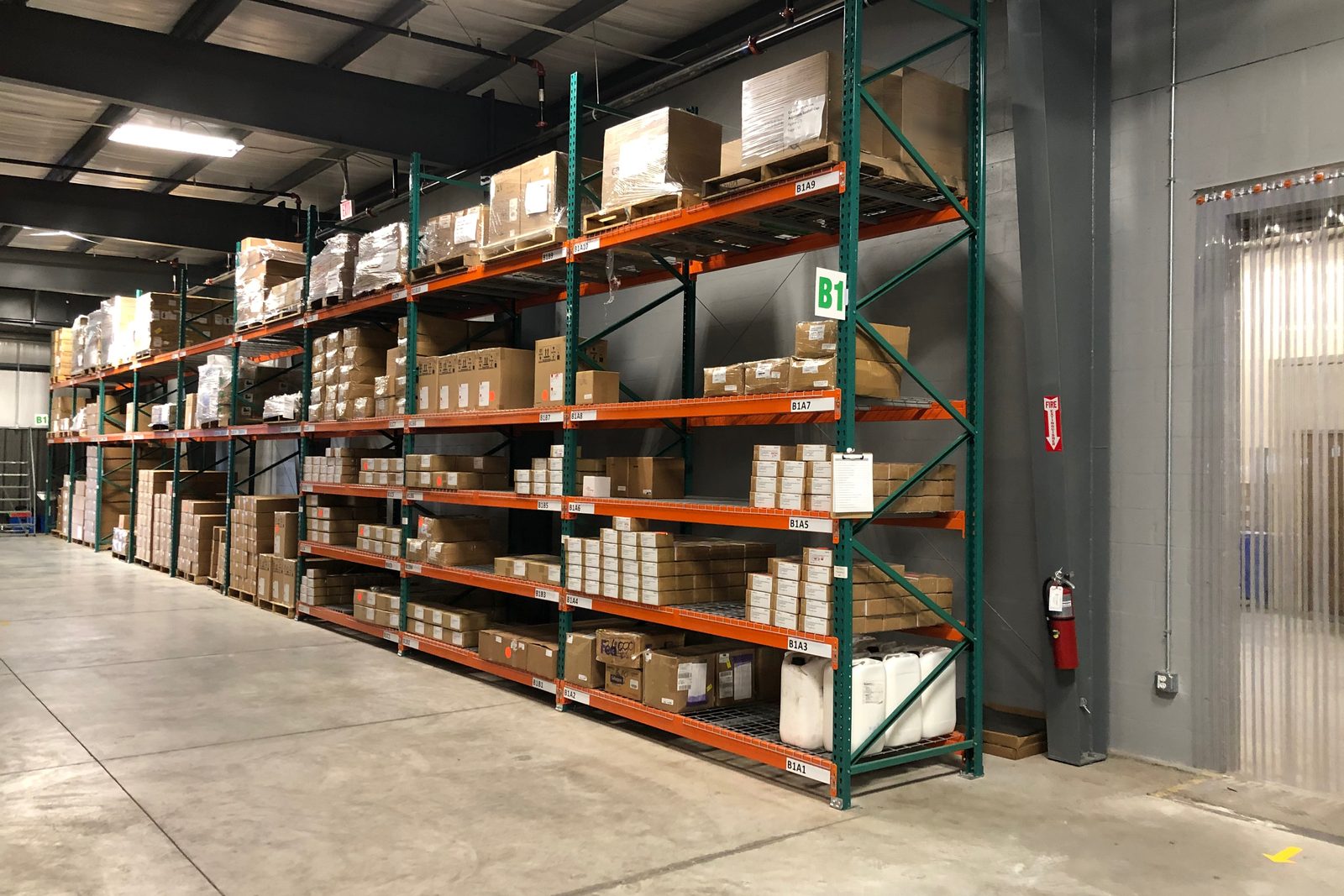 Pallet racking with a printed location label on every shelf level